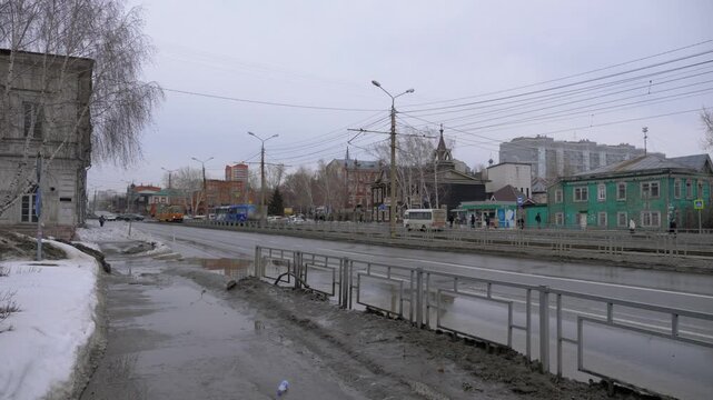March 22 2026 Barnaul Russia view of old houses on Krasnoarmeysky Avenue covered in snow cold early spring urban cityscape historic architecture and winter atmosphere.