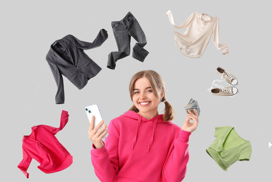Happy young woman with money and mobile phone on light background. Sports bet concept