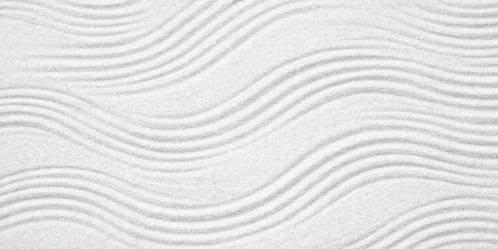 Abstract white sand texture background features a wavy nature pattern of dry desert dunes with a grainy material surface