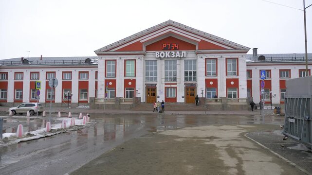 March 22 2026 Barnaul Russia railway station building covered in snow cold early spring cityscape urban architecture and winter atmosphere.