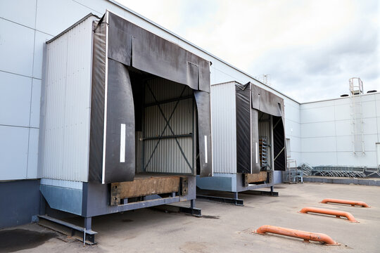Loading docks or loading bays with bumpers, levelers, lift, dock seals or shelters, traffic lights. Loading bay is area of building where goods vehicles road or rail are loaded and unloaded.