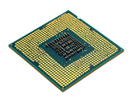 Central processing unit (cpu) with grid of gold contact pins and green pcb surface