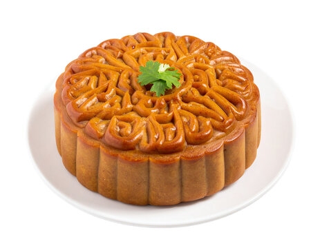 Chao chao doge mooncake on plate with glazed caramel surface and leaf garnish