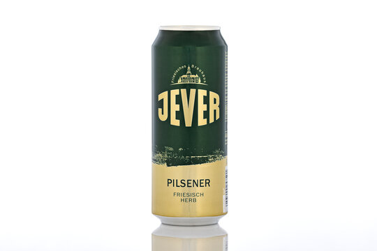 Jever Pilsener beer can photographed in studio on white background with reflection, showcasing German pilsner branding and minimalist packaging design.