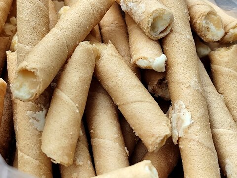 A stack of semprong, or egg rolls, fills the entire frame.