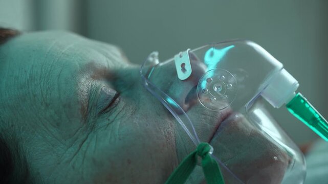 Elderly woman wearing oxygen mask or CPAP in hospital or home