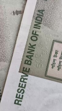 Five hundred rupee indian currency bank note signs and symbols stop motion extreme closeup macro flat lay top view. India inflation, tax, reserve money, economy, banking and investment concept.