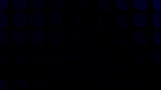 Abstract loop animation of glossy blue spheres arranged in a grid with smooth gradient lighting transitions on dark background. Modern technology, data visualization and digital interface concept.