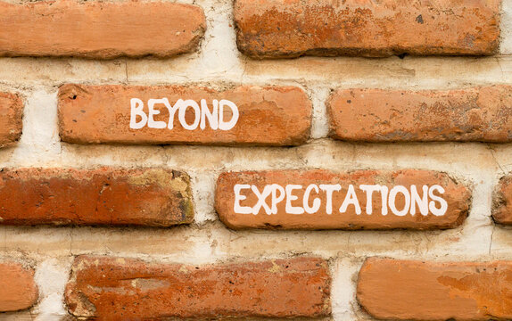 Beyond expectations words symbol. Concept words Beyond expectations on beautiful brick wall. Beautiful brick wall background. Business and Beyond expectations words concept. Copy space.