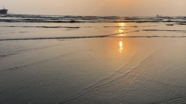 Golden Sunset at Parki Sea Beach with Shimmering Waves and Ships on Horizon, Chittagong