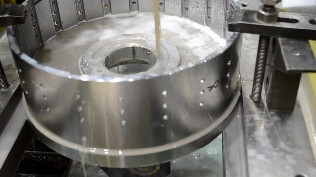 Wire-cut electrical discharge machine. Operation of wire-EDM machine cutting metal parts. Electrical discharge machine EDM cutting metal workpiece. Cutting process by wire cut machine. Metalworking