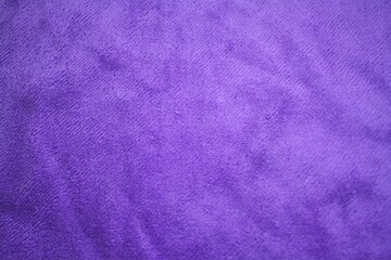 Close up soft purple fabric texture, wavy microfiber material background © Vall