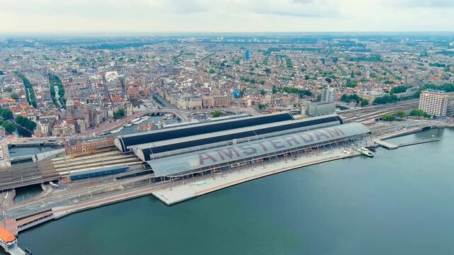 Amsterdam, Netherlands. Amsterdam Central Station. Amsterdam Centraal - The largest train station in the city, built in 1889. Bay IJ (Amsterdam). Drone footage