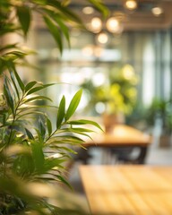 Fototapeta premium Blurred bokeh background of modern eco friendly office with indoor plants natural wood elements sustainable workplace environment. Green corporate culture environmental business responsibility.