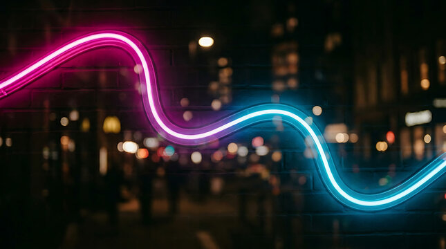 Abstract wavy pink and blue neon light path flowing through a blurred nighttime urban city street background with abstract