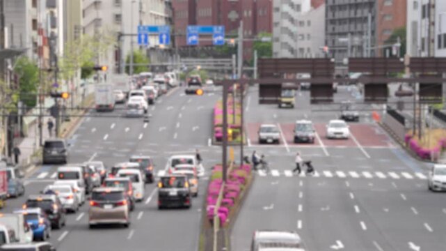 Urban street scene in Tokyo with people and traffic in spring
