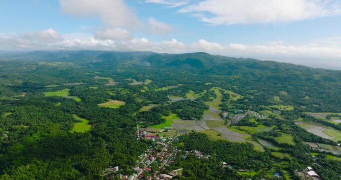 Tropical landscape with village of farmers and agricultural land in Tablas Island. Romblon, Philippines.