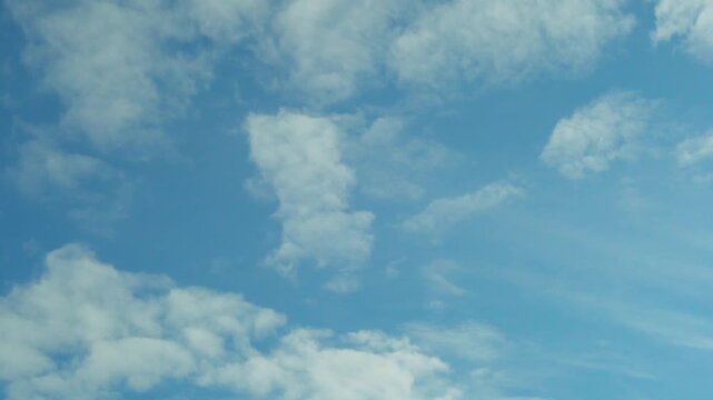 Sunny summer clear blue sky white cumulus clouds sun air plane window view aerial drone view, time lapse, motion. Azure skyscraper with clouds 4K. 