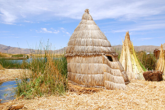 TITICACA LAKE PUNO PERU: Titicaca is notable for a population of people who live on the Uros, a group of 44 or so artificial islands made of floating reeds.