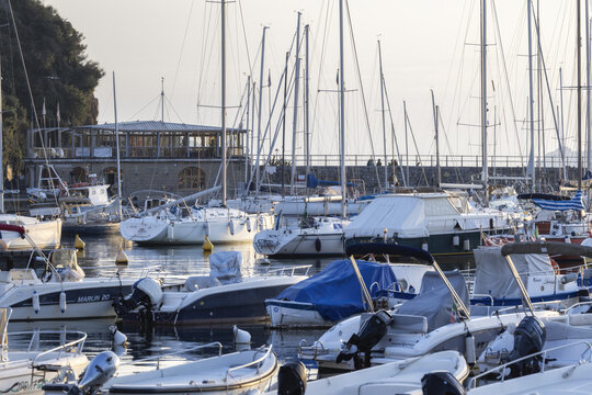 Lerici, Italy - 08 March 2026: View of the marina, where masts reach skyward, a serene panorama of boats bobbing gently under the soft, diffused light, framed by the town's architecture.