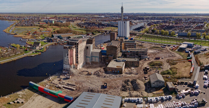 Aerial view of the skeletal remains of the Meneba Flour Mill against the backdrop of the river Zaan, Wormerveer, Netherlands.