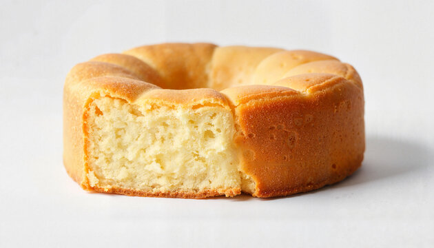Baked round cake with a slice cut out on white background  