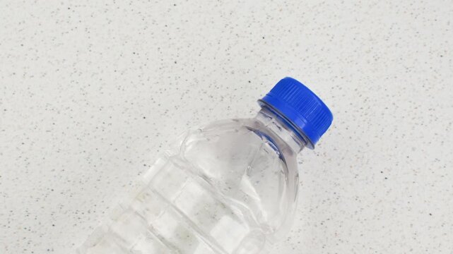 Recyclable plastic bottle, symbol of sustainability and care for the environment. Recyclable plastic bottle detail, an ecological choice to reduce environmental impact.