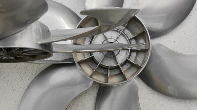 New fan impeller, disassembled into a technical composition, ready for assembly and use. Meticulous detail of newly manufactured fan impeller, disassembled for inspection and assembly.