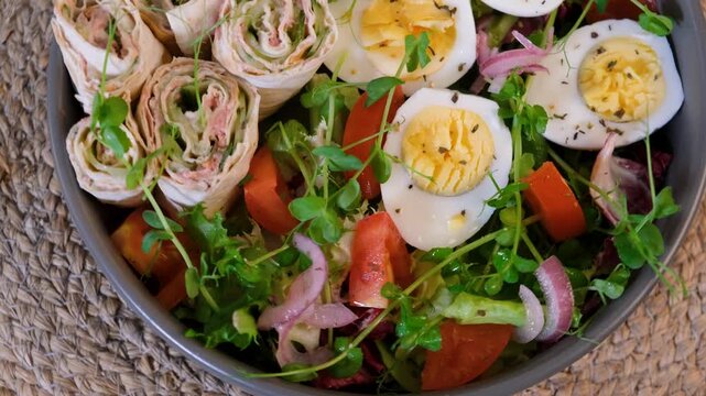 Keto diet meal with tuna lavash rolls salad and boiled eggs