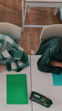 Above, students and sleeping in high school with fatigue, difficult assessment and education burnout. Tired, teenager and girls nap in classroom with study exhaustion, stress and lazy for learning.