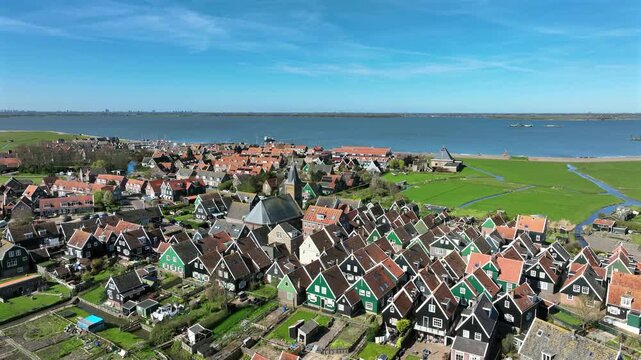 Historic lakeside village with prominent church in Europe