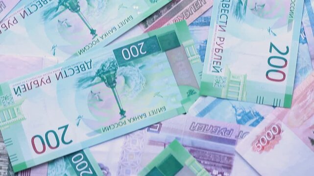 Top view video. Russian paper banknote 100, 200, 500, 5000 rubles bill. Bank note. Cash money of Russia. Concept of salary, pay tax, debt, loan, bribe, buy, financial crisis, currency exchange, budget