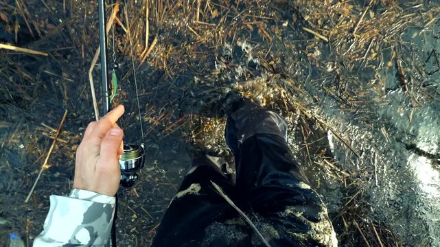 Angler Wading In Muddy Water For Fishing Trip. Outdoor Recreation And Hobby In Nature