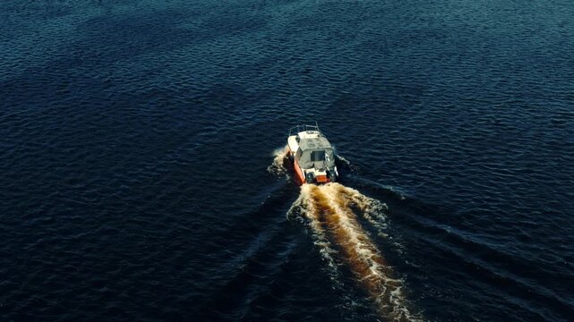 Motorboat Speeding. Powerboat Cruising On Rippled Water Surface. Maritime Transportation And Nautical Adventure