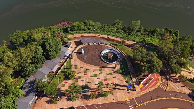 Aerial footage of Hito Tres Fronteras monument and park in Puerto Iguazu, Argentina, overlooking the river confluence