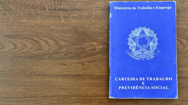 Brazilian work ID on a wooden surface, symbolizing employment and career in the Brazilian context.