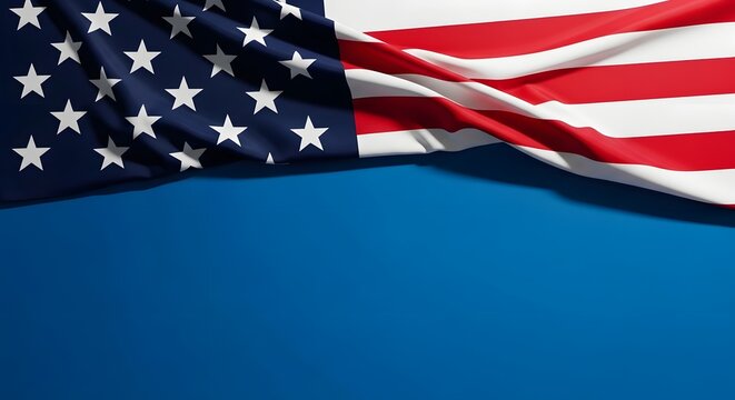 American flag waving on blue background with red and white stripes and white stars
