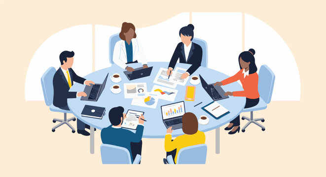 Team meeting around a table, engaged in discussions and using technology