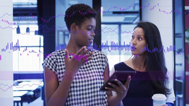 Two women duo in business office left lead tapping tablet demoing causing charts syncing for review