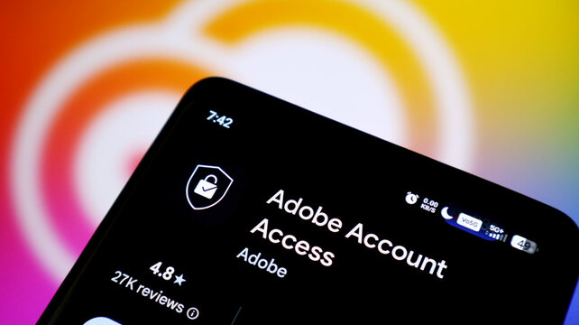 Closeup of a smartphone screen displaying the adobe account access app store page