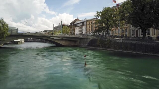 River Flowing Under Bridge in Historic European City