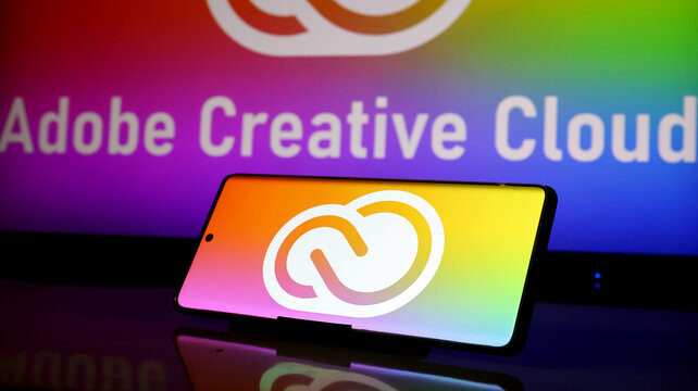 Adobe creative cloud logo displayed on a smartphone screen with a colorful background