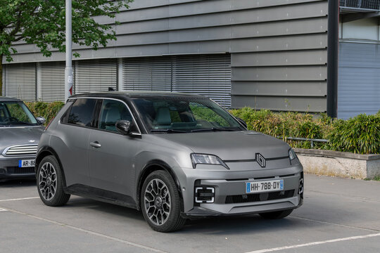 Nancy, France - April 17th 2026 : View on a matte grey Renault 5 E-Tech Roland-Garros finished in satin slate grey parked on a street.