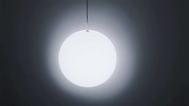 Suspended round light fixture emitting glow symbolizing peace, mindfulness, and relaxation