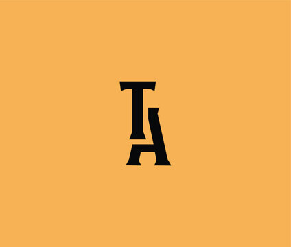 Photograph of the letter T and A joined together on a peach background