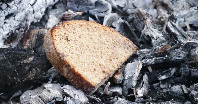 pieces of bread are fried on coals