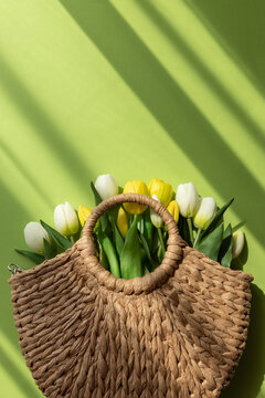 Mothers Day Straw Bag with Colorful Tulips on Green Background