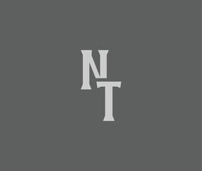 The letters N and T are centered on a solid gray background © Mahamud