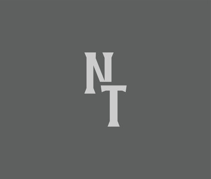 The letters N and T are centered on a solid gray background