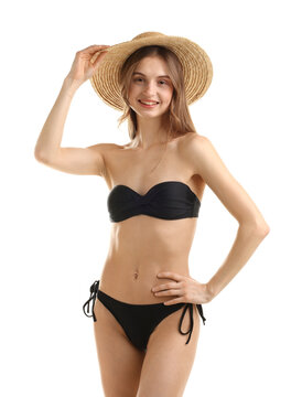 Beautiful woman wearing stylish swimsuit and hat on white background